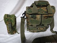 Sling pack front and bottle pouch side-by-side