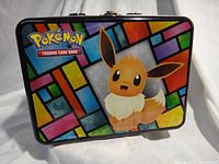 Front view showing Eevee artwork and Pokémon TCG logo