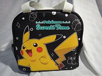 Front view showing Pikachu graphic and Sweets Time branding