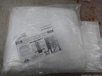 Tarp in sealed packaging with label visible