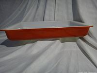 Side profile showing burnt orange exterior and shallow depth