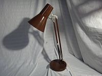 Left-front view showing shade, arm, base and cord