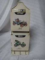 Front view showing two compartments, car graphics, rust spots