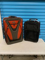 Front view of both suitcases side by side