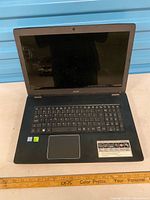 Open laptop showing screen, keyboard, touchpad