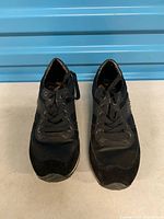 Top view of both sneakers showing laces, toe condition and overall wear