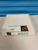 Closed original cardboard box with printed product label