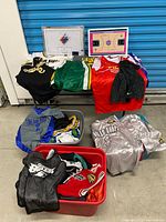 Overall view showing bins of jerseys, shorts, and two coaching boards