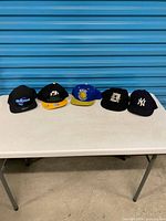 Five caps lined on table