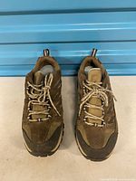 Top view of both shoes showing uppers, laces and overall wear