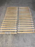 Two Luroy slatted base sections side by side on floor