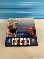 Front of Infantino Sync carrier box showing model image and weight range 8-36 lb