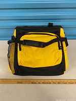 Front view of yellow and black insulated cooler bag