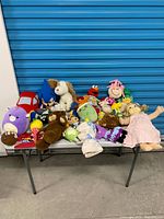 Overall view of all plush toys on table