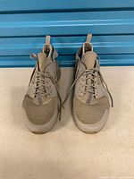 Top view of both sneakers showing lacing, toe boxes, overall wear