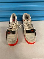 Top view of both Nike Air Trainer sneakers showing laces, strap and wear