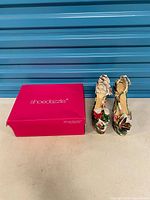 Shoedazzle shoe box and pair of tropical print heels side by side