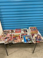 Table view of entire magazine lot in plastic sleeves