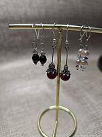 Front view showing all three pairs on stand