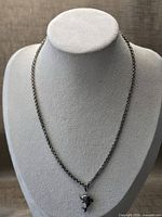 Full view of sterling silver necklace on display bust