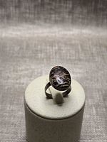 Front view of sterling ring on display showing stone and setting