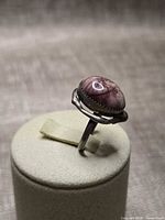 Ring profile showing sterling mount and oval pink stone