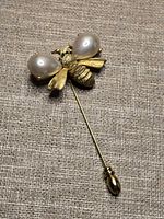 Full view of bee stick pin showing overall design and end cap