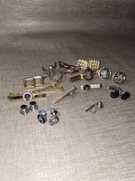 Overall lot showing cufflinks, tie clips and tacks
