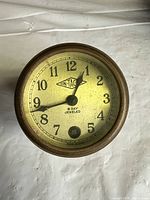 Front view showing dial, branding and numerals