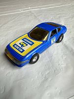 Left front quarter view of blue Corgi Ferrari Daytona with decals
