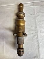 Overall view of brass Gaertner telescope showing maker’s plate and eyepiece