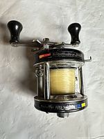 Side view showing Garcia Ambassadeur 5000C badge, spool with monofilament line