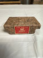 Front view showing Herman Surface Plate label and handhold recess