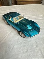 Top front three-quarter view of teal 1969 Corvette model