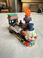 Left-front view of multicolor resin Halloween train figurine