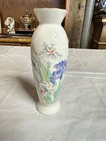 Full view of porcelain vase front showing floral design