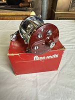 Penn Peerless No. 9 reel on top of original box, front plate view