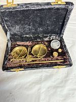 Open case showing full scale set with beam, pans, weights and velvet interior