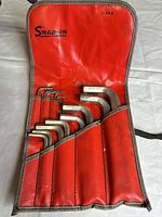 Open vinyl pouch holding 12 hex keys