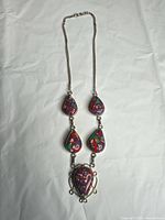 Full view of necklace showing chain, pendant arrangement and overall length