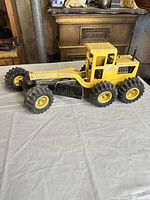 Left side view of Tonka motor grader showing overall form