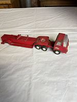 Tonka red pressed-steel cab attached to lowboy trailer showing overall condition