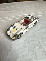 Oblique view of the roadster showing body, interior and paint wear