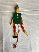 Full front view of wooden marionette puppet