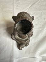 Top view showing open-mouth cavity of bronze monkey