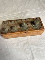 Full view of hardwood block with all ten weights inserted