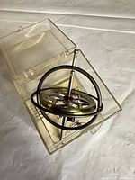 Gyroscope inside clear plastic box