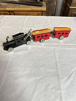 Full view of toy truck with two trailers connected
