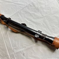 Full length view of Weaver K-6 scope with leather caps