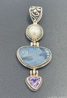Front view of pendant showing opal, pearl, amethyst and bail